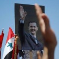 portrait du president syrien lors d'une manifestation de ses partisans à Damas
