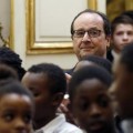 François Hollande entouré d'enfants lors du sapin de Noël le 12 décembre 2014 à l'Elysée